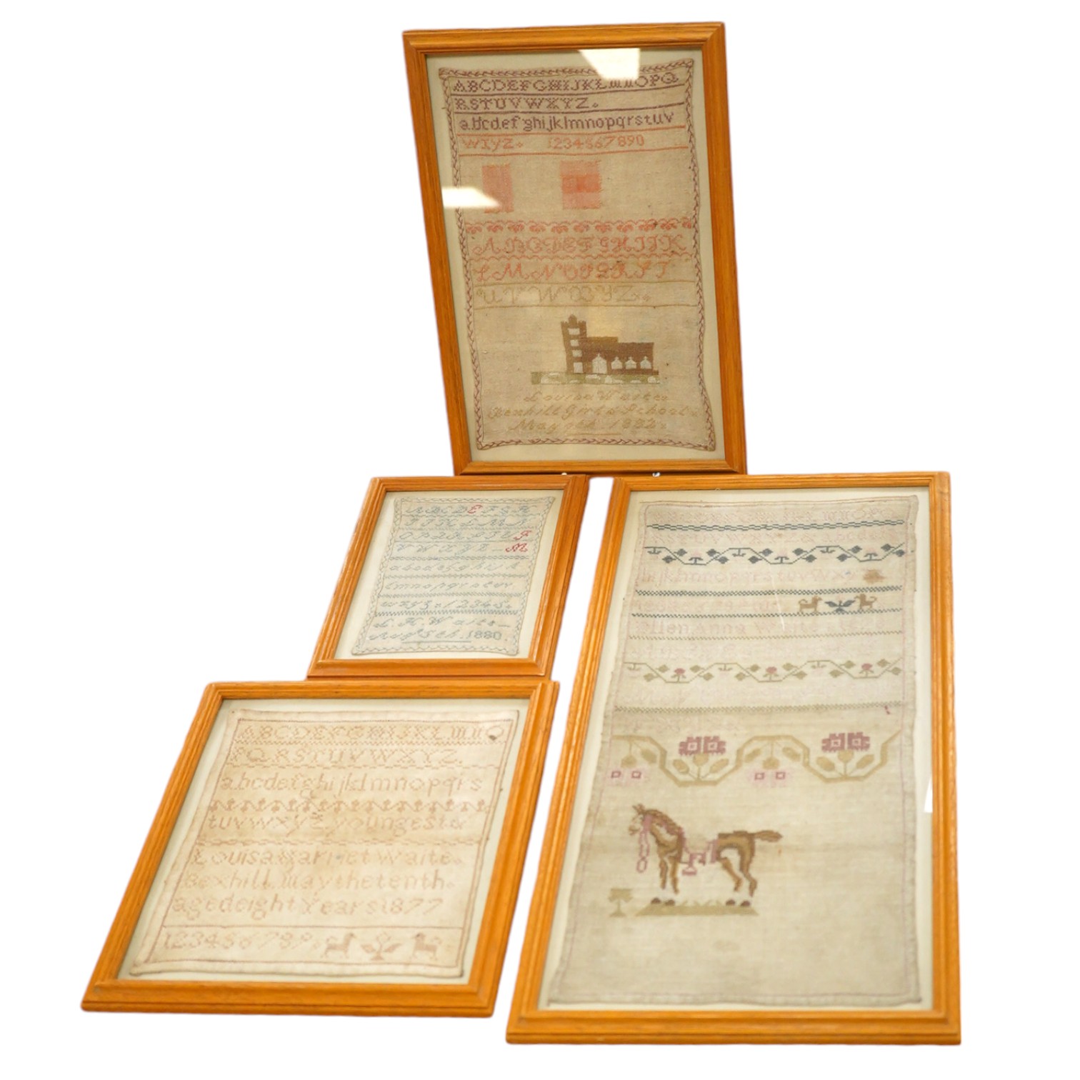 Four 19th century needlework samplers, one by Ellen Anna Waite, 1878 and three by Louisa Harriet Waite dated 1877, 1880 and 1882. Louisa Harriet Waite samplers; two are alphabet samplers and one is a darning sampler with